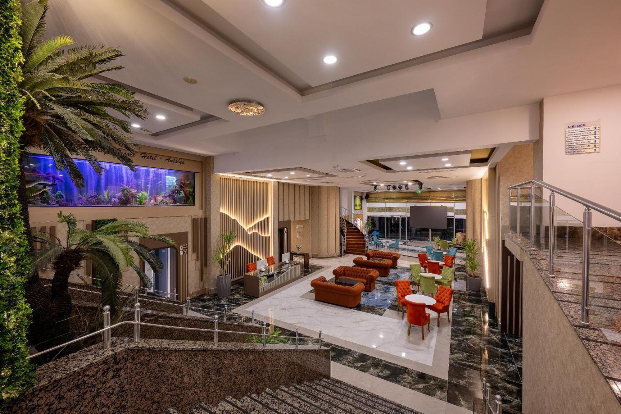 Sealife Family Resort Hotel Antalya Luaran gambar The photo shows a spacious and modern lobby area of a building, possibly a hotel. It features a combination of elegant decor and comfortable seating arrangements. There are large windows allowing natural light in, and the space includes a mix of indo